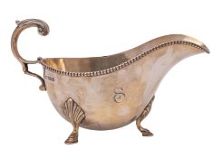 A George V silver sauce boat, makers Mappin & Webb, Sheffield, 1913 initialled,
