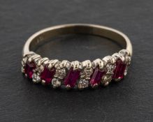 A round, brilliant-cut diamond and baguette-cut ruby half-eternity ring,