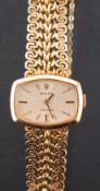 Rolex a ladies 18ct gold dress watch the shaped dial with raised baton numerals,