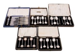 A set of six George V silver teaspoons and a pair of matching sugar tongs,