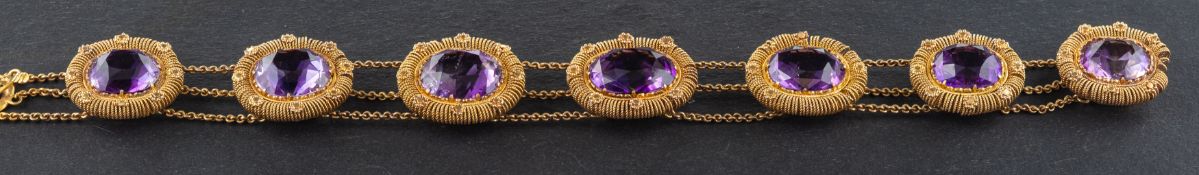An oval, mixed-cut amethyst bracelet,