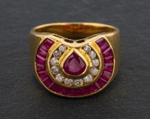 A calibre, pear-shaped ruby and round, brilliant-cut diamond horse-shoe shaped cluster ring,