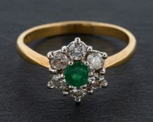 An 18ct gold, round, mixed-cut emerald and round, brilliant-cut diamond cluster ring,