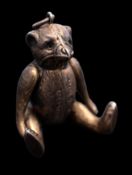 An Edward VII silver gilt articulated Teddy Bear pendant, maker H V Pithey & Co,