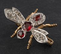 A 9ct gold, mixed-cut garnet and single-cut diamond bee brooch, total estimated diamond weight ca.