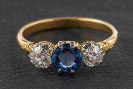 An old-cut diamond and probably synthetic sapphire, three-stone ring,