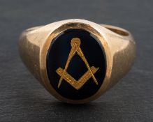 A 9ct gold masonic ring, onyx inset with gold compasses, length of ring head ca. 1.