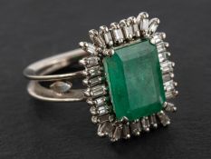 An emerald-cut emerald and baguette-cut diamond cluster ring, estimated emerald weight ca. 4.