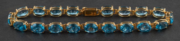 An oval, mixed-cut blue blue zircon bracelet, estimated total zircon weight ca.