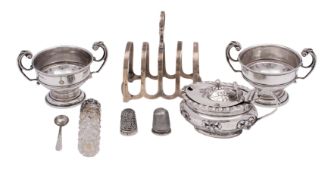 A silver oval lidded mustard (hallmarks rubbed) with embossed ribbon tied drapery swags,