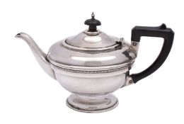A George V silver circular teapot, maker T.S.