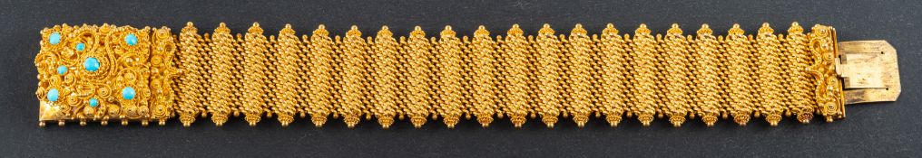 A 19th century, mesh-link bracelet with cannetille decoration, the clasp set with round,