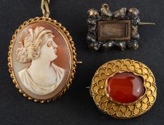 Three brooches, including a Georgian hairwork brooch,