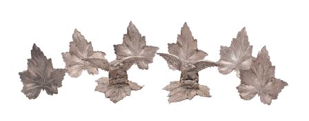 A set of eight silver plate menu/place card holders,