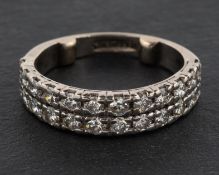 A double-row, round, brilliant-cut diamond, half-eternity ring, total estimated diamond weight ca.