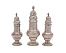 A George III silver suite of graduated muffineers/ castors, makers Jabez Daniell & James Mince,