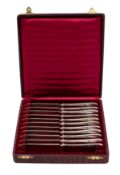 A set of eleven (of twelve) Swiss silver 800 dessert knives with reeded and oval decorated handles,