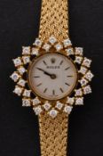 Rolex, a lady's 18ct gold and diamond wristwatch the champagne dial with baton numerals,