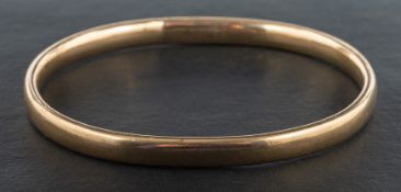 A bangle, stamped '9CT', inner diameter ca. 6.7cm, total weight ca. 37.7gms.