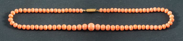 An early 20th century, graduated coral bead necklace, diameter of coral beads ca. 4.3-8.