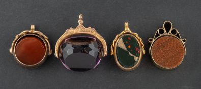 Four swivel fobs, including a 9ct gold, Edwardian, purple paste fob; a 9ct gold,