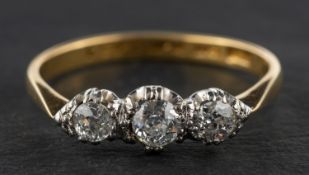 An old-cut diamond, three-stone ring, total estimated diamond weight ca. 0.