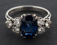 A mid-twentieth century, mixed-cut, cushion-shaped sapphire and round,