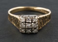 A round, brilliant-cut diamond cluster ring, of square design, total estimated diamond weight ca. 0.