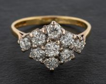 A 1970's 18ct gold round, brilliant-cut diamond cluster ring, total estimated diamond weight ca. 1.
