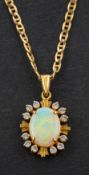 A white paste and cabochon-cut opal cluster pendant, stamped '14K', length ca. 2.