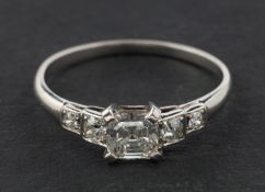 An old and octagonal step-cut diamond ring, estimated weight of principal diamond ca. 0.