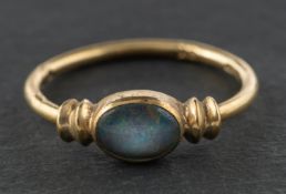 A 9ct gold, black opal doublet ring, with import marks for London, 1978, length of ring head ca. 1.