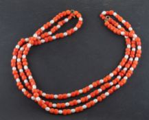 A coral and cultured pearl, triple-strand 'choker' necklace, diameter of coral ca. 4.7-6.