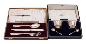 A cased pair of George V silver salts and spoons makers Walker and Hall, Birmingham 1934,