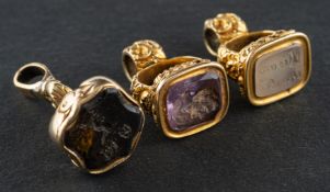 Three gemset fobs, including an amethyst fob, a smokey quartz fob and an agate fob,