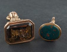 Two gemset fobs, including one of smokey quartz engraved with monogram 'HI',