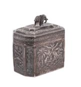 An Indian white metal lidded box of octagonal form with repousse decoration of a tiger near a