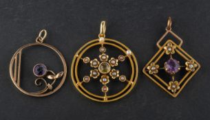 Three gemset, openwork pendants, including a peridot and seed pearl pendant,