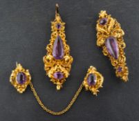 A pear-shaped, round and oval mixed-cut amethyst pendant and three brooches,