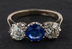 A blue paste and cushion-cut diamond, three-stone ring, total estimated diamond weight ca. 1.
