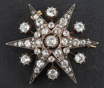A late 19th century/ early 20th century, old and rose-cut diamond star brooch/ pendant,
