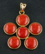 A late 20th century, Italian, cabochon-cut coral, cinquefoil, pendant,