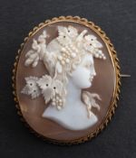 A shell cameo brooch, depicting Dionysius in profile, with ropetwist surround, total length ca. 4.