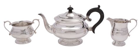 A George V silver three-piece tea service, makers Roberts & Dore Ltd,