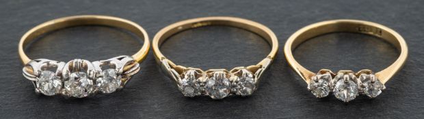 Three old-cut diamond three-stone rings, including a ring, total estimated diamond weight ca. 0.