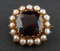 A 19th century, cushion-cut garnet and seed pearl cluster brooch/ pendant, length ca. 1.