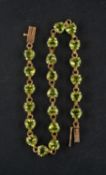 A heart-shaped peridot bracelet, total estimated peridot weight ca. 6.