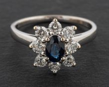 A Goldsmiths & Co, 18ct gold, oval, mixed-cut sapphire and round,