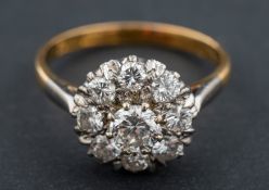 A round, brilliant-cut diamond cluster ring, total estimated diamond weight ca. 0.