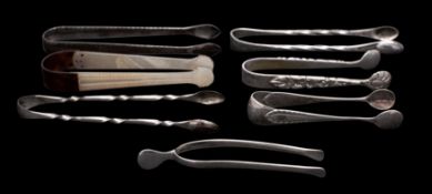 A collection of sugar tongs to include a pair of tortoiseshell and mother-of-pearl examples,